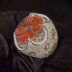 Kiss The Ring Of A Moissanite Oval Spessartine Ring