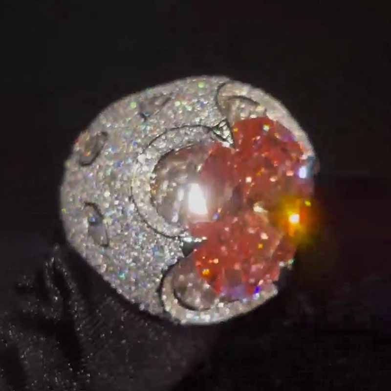 Kiss The Ring Of A Moissanite Oval Spessartine Ring