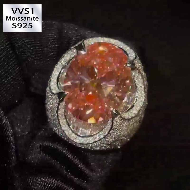 Kiss The Ring Of A Moissanite Oval Spessartine Ring